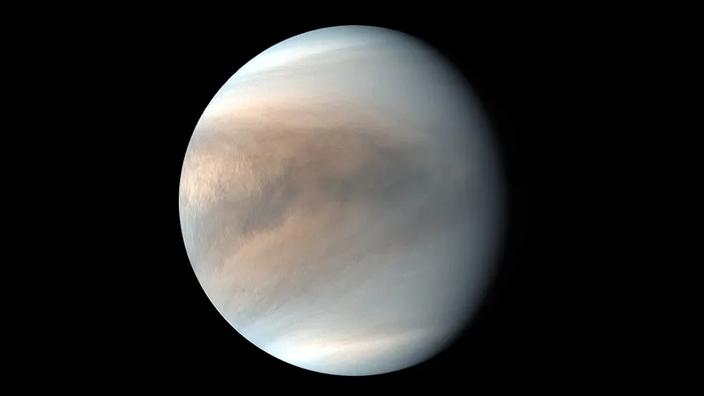 A near-infrared photo of the night side of Venus taken by JAXA's Akatsuki spacecraft in 2016. The dark line down the middle is the sharp cloud wall. Thick clouds are on one side, thin clouds on the other. The full wall is about 6000 km long and goes from the north to the south of Venus. Image: JAXA / Akatsuki team.