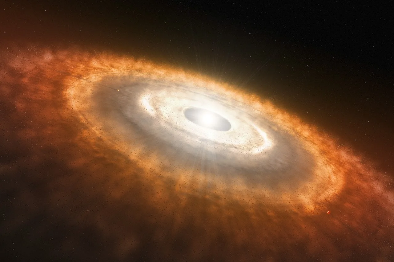 This image shows what our solar system may have looked like more than 4.5 billion years ago — a spinning disk of gas and dust surrounding a young Sun. Rocky objects were just beginning to clump together inside this disk, eventually carrying life's ingredients to planets like Earth. Illustration: ESO / NASA.