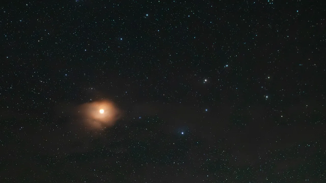 This month, the western sky becomes a stage. Venus and Jupiter — two of the most dazzling objects in the night sky — appear so close together that you can cover both with your thumb at arm's length. No telescope needed. Just step outside after the Sun sets and look west. NASA/JPL-Caltech.